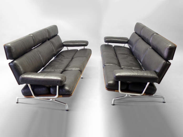 Pair Aluminum base Walnut Trim Black Leather Couches by Charles and Ray Eames for Herman Miller. Eames Office Last Work for Herman Miller. Arms extend 4