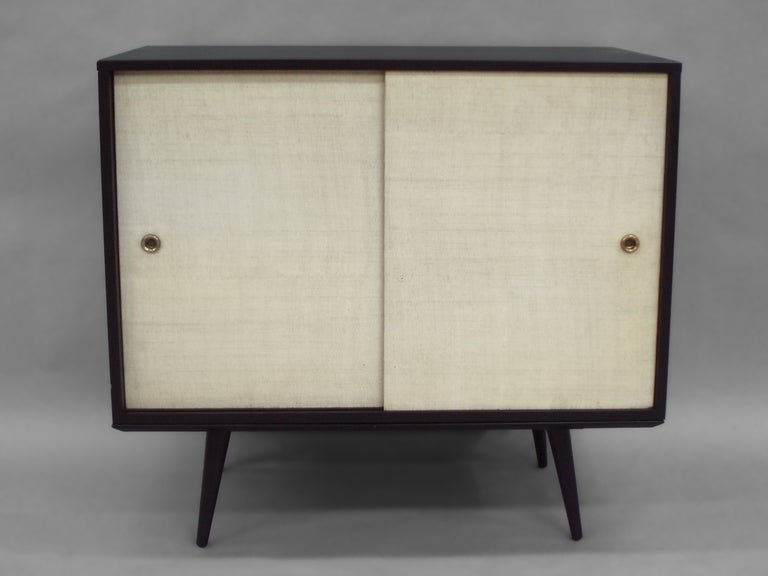 Ebonized Sliding Door Cabinet on Bench by Paul McCobb