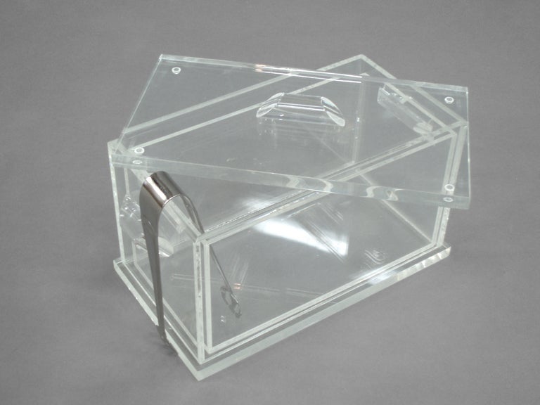 Lucite ice bucket possibly by Ritts Co.
         