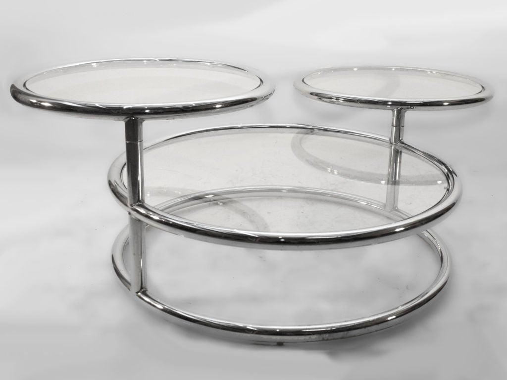 1970s version of classic Art Deco swing arm adjustable coffee table. Bottom center disk: 30