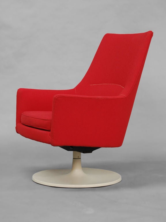 High back upholstered swivel Chair with circular base, also suitable as a lounge chair.
