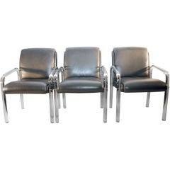 Six Silver leather and lucite arm chairs