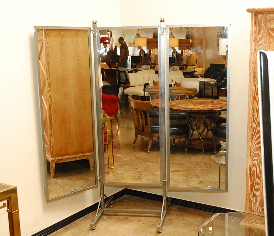 Rare French standing mirror with faux turtle shell finish on back of each panel attributed to Jacques Adnet.