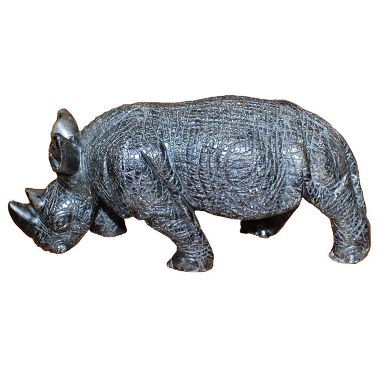A Whimsical Carved Stone Rhino Sculpture.