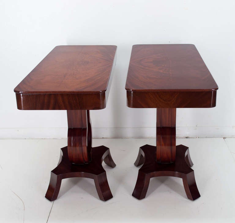 A pair of Art Deco consoles each having a single drawer, lyre pedestal with a center glass decoration. Oak is the secondary wood. French polish finish.