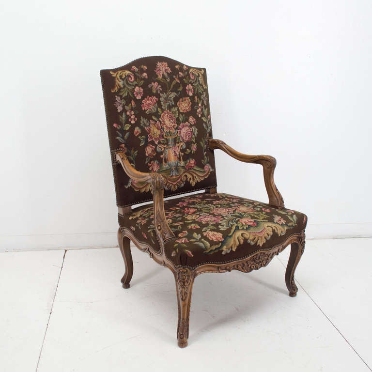 A good and sturdy pair of arm chairs with a petit-point fabric. The frame is made of walnut and the seating is good.