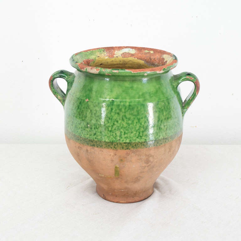 A green glazed Pot a Confit from the South west of France. We have a large selection of yellow glazed and green glazed pot a confit. Inquire within.