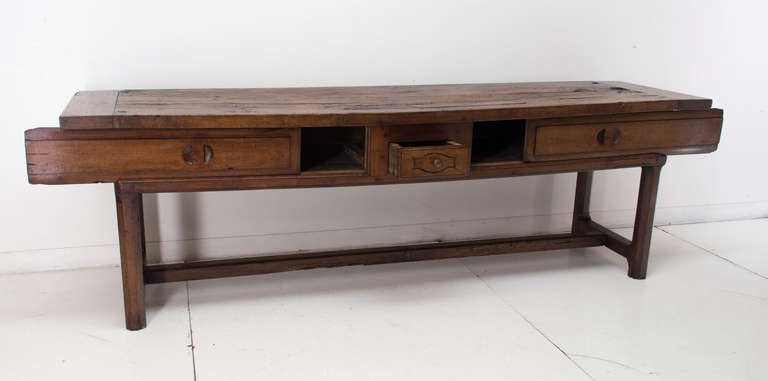 An eight feet long table made of walnut and chestnut. with two slides and one drawer in the apron. The 1.5