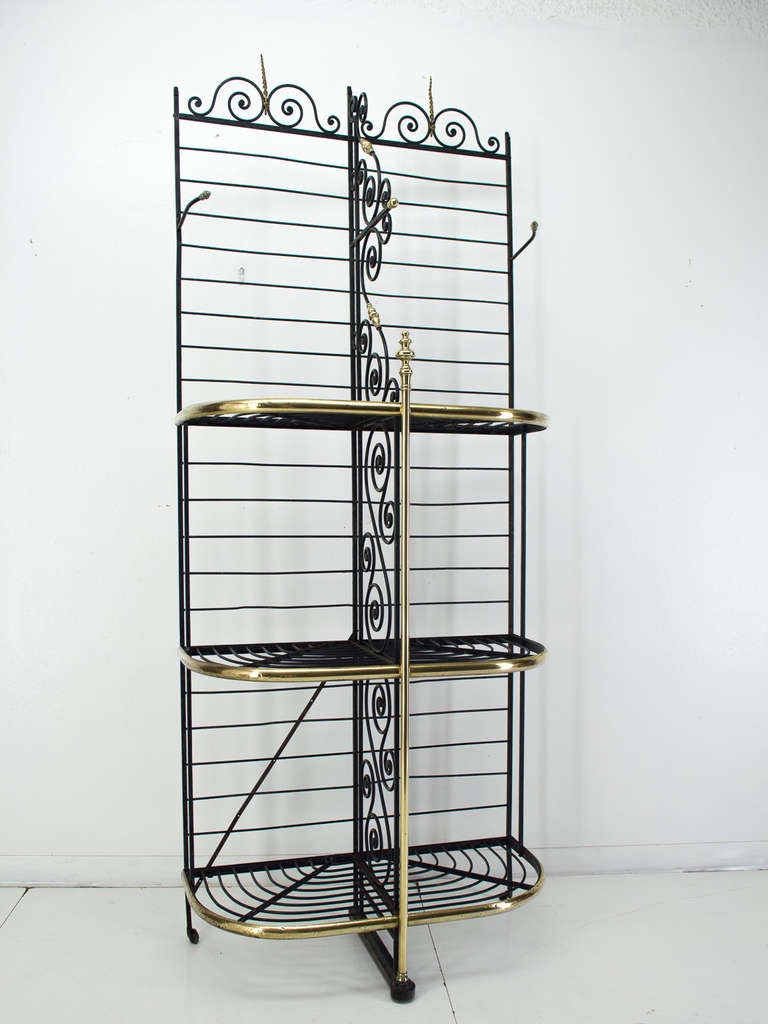 A wrought iron backer's rack with brass trim. Beautiful iron work and perfect for a kitchen.
As always, more photos available upon request. We have a large selection of French antiques. Please visit our web site.