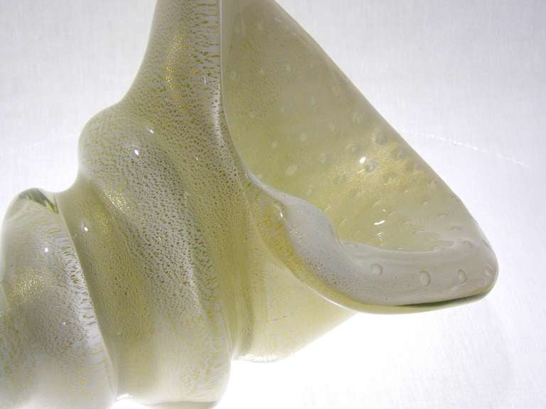 Rare and extremely large Barbini centerpiece bowl. This monumental white Murano glass bowl is filled with loads of gold aventurine and controlled bubbles on the interior. Designed by Alfredo Barbini. This is an extremely large and heavy bowl