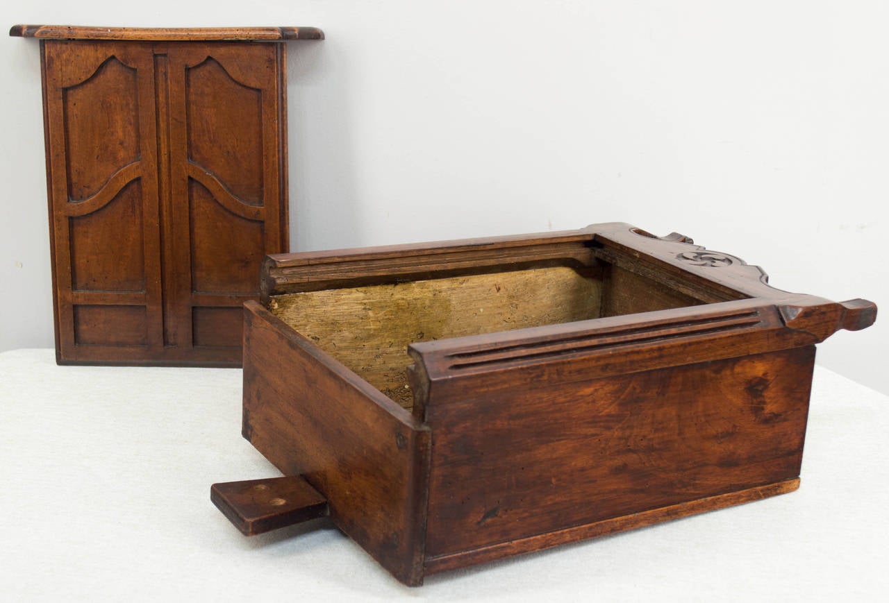 Early 19th century French fariniere, or flour box in the rare form of an armoire. Made of walnut and finely crafted with dovetail construction and curved legs. 16" H x 10" W x 6" D Restoration on right leg.
More photos available upon