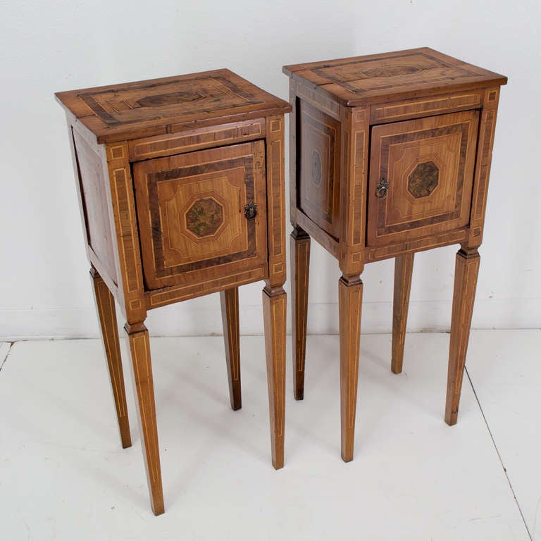 An excellent pair of Italian side tables made of cherry, walnut and burl of olive woods with a warm patina.