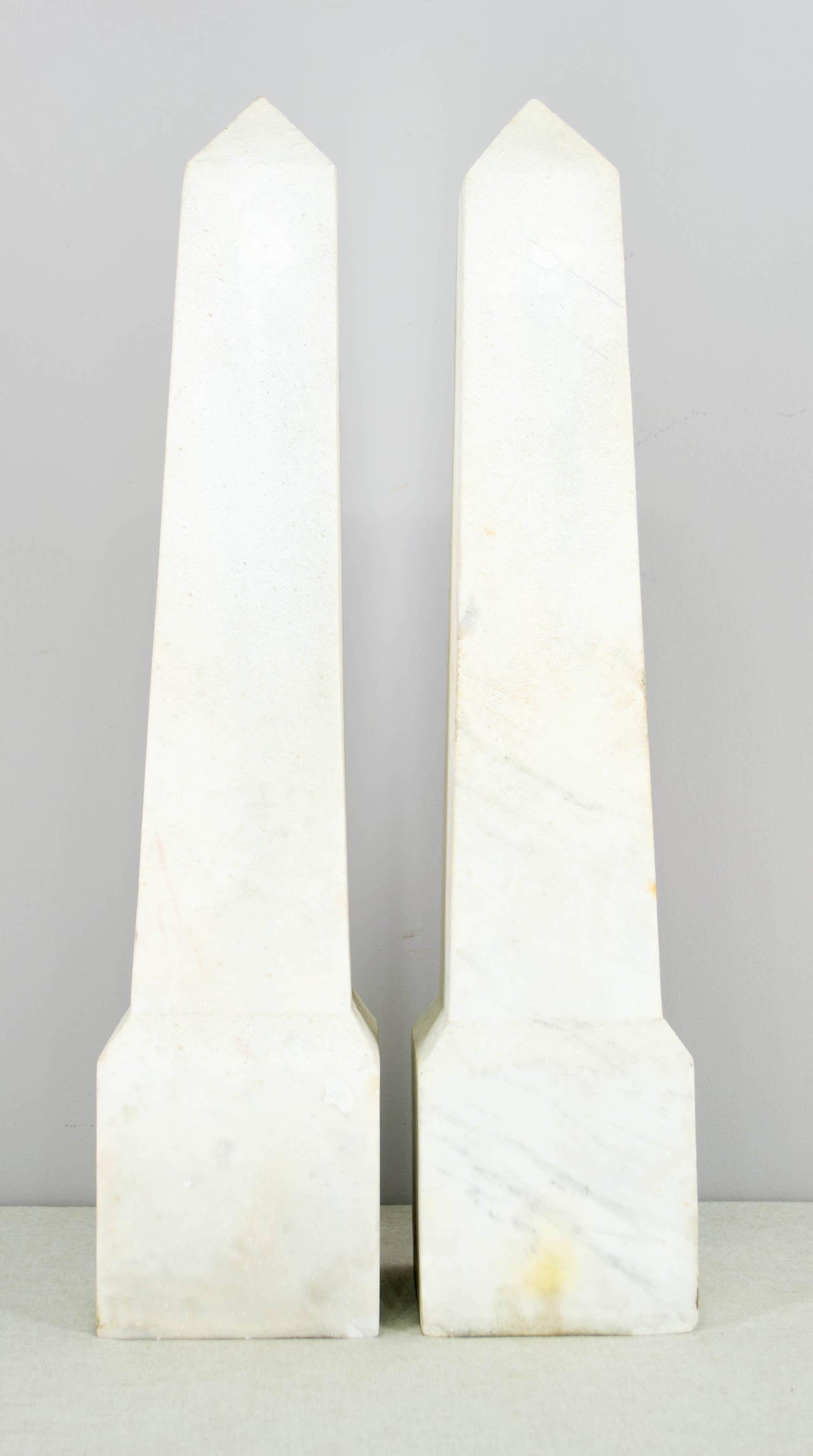 Pair of French marble obélisques. Very white color with a some faint grey veining especially toward the bottom. Weight: 42 lbs. each. As always, more photos available upon request. We have a large selection of French antiques. Please visit our web