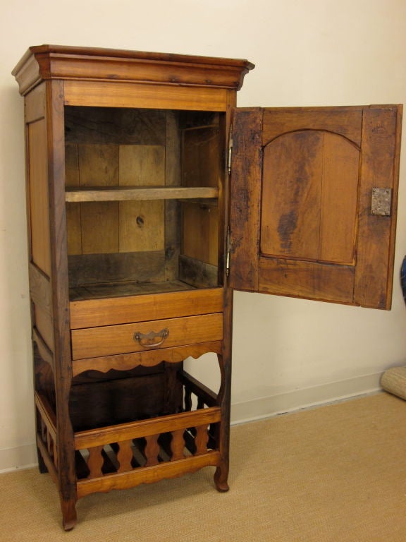 From the Brittany province made of cherry and chestnut this is a great French Country piece. With its slim proportions, this cabinet would be a perfect addition to an authentic country kitchen or dining room. Front panel has beautiful wood grain and