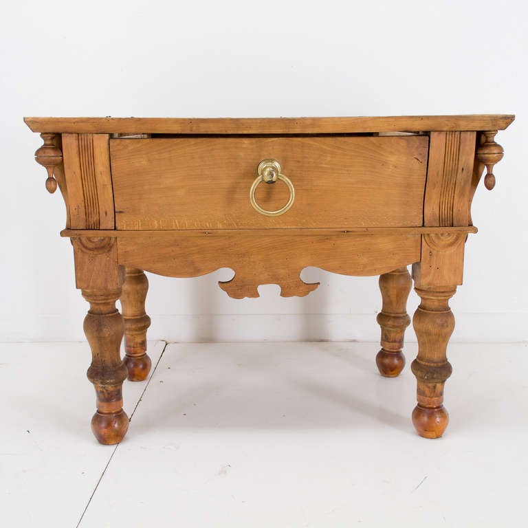 Made of beechwood with a large drawer, brass handle, four decorative finials. Restoration on the legs. Just add you marble top of your choice and voilà.