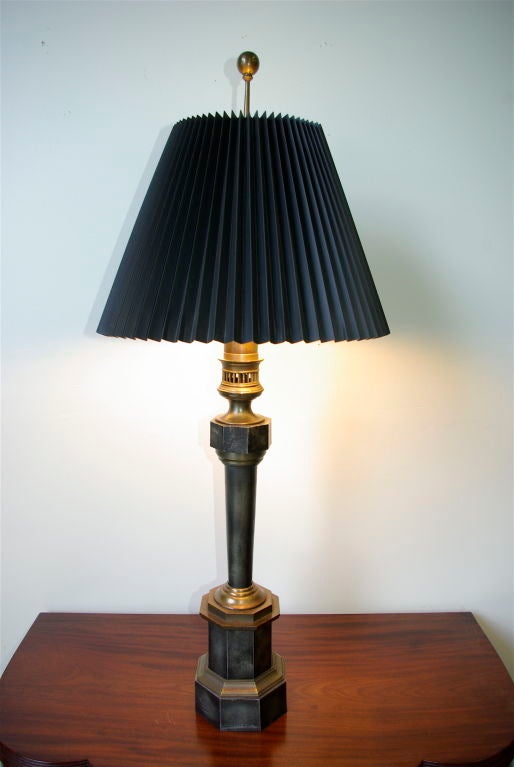 A fine pr. of Lamps by Chapman lighting Co. These are fabricated from faux painted metal, and brass. Professionally rewired.  Each lamp holds two bulbs with independent pulls.