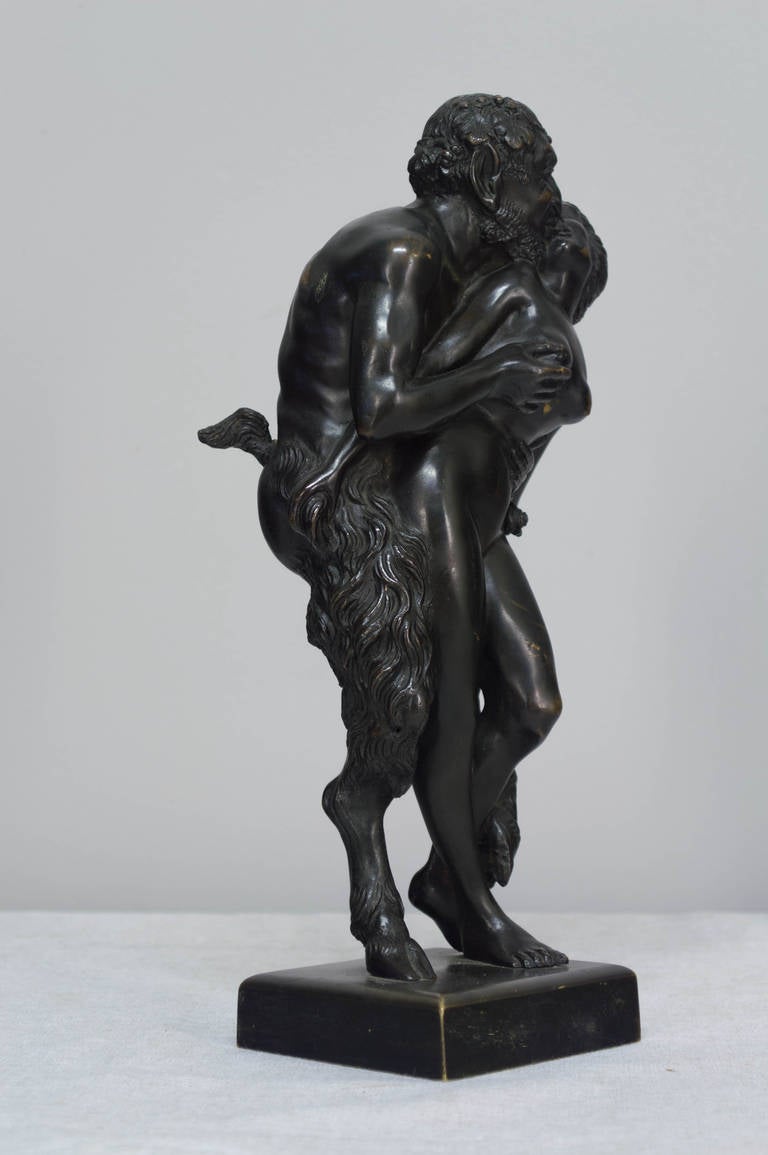 A bronze patinated French sculpture of a satyr and a virgin, unsigned. Please refer to photos for more details. We have a large selection of French antiques at Olivier Fleury, Inc.  Please visit our showroom in Winter Park, Florida.