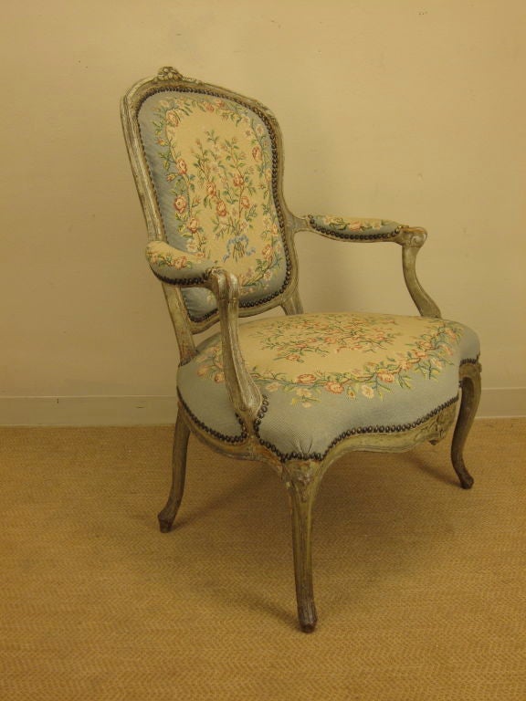 A very elegant beechwood painted fauteuil with petit-point fabric. Very comfortable with a large seating. 28