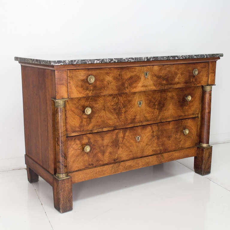 A fine three drawer chest with walnut veneer for the front and solid walnut on the sides, retaining its original grey veined marble top (1.25