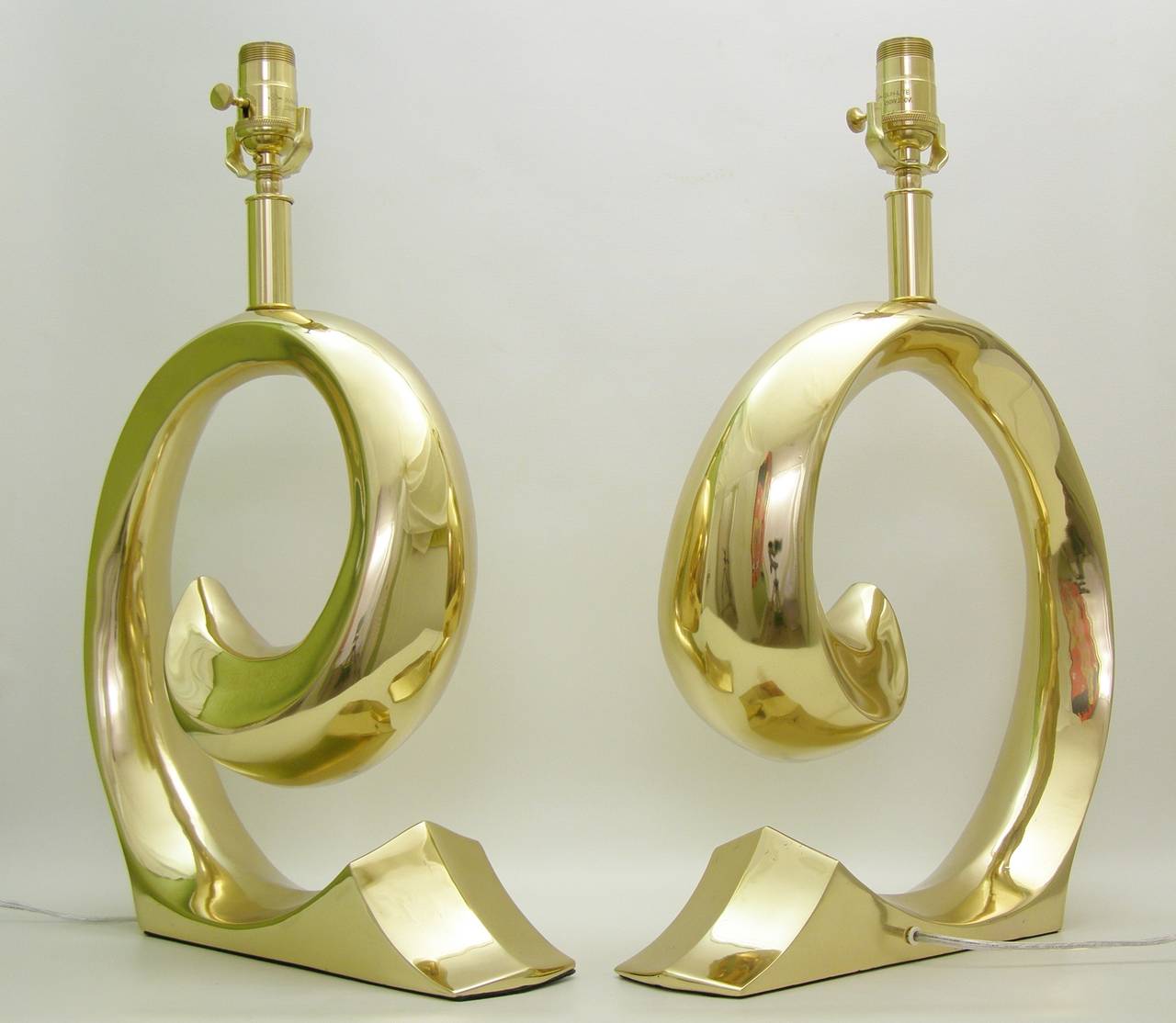A pair of  Brass Pierre Cardin Lamps, with the Pierre Cardin Logo, newly restored and rewired, solid brass, polished and lacquered. Original finals included.
The overall height is 20