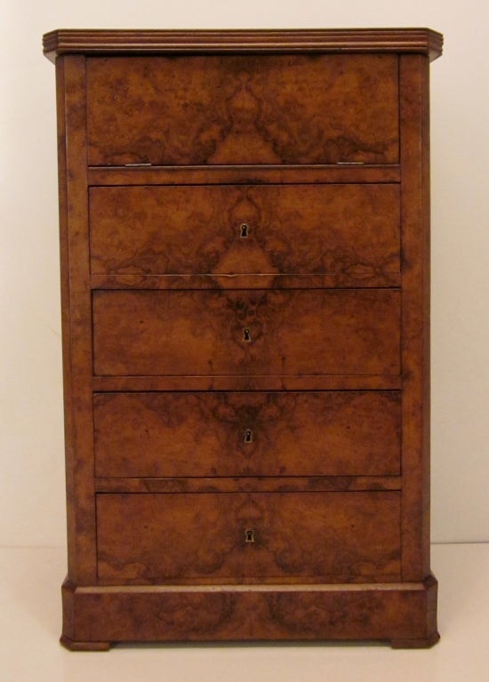 A chest of drawers made of burl walnut, dovetailed construction, with an opening revealing a marble insert and a mirror, used as a vanity. Good proportion.