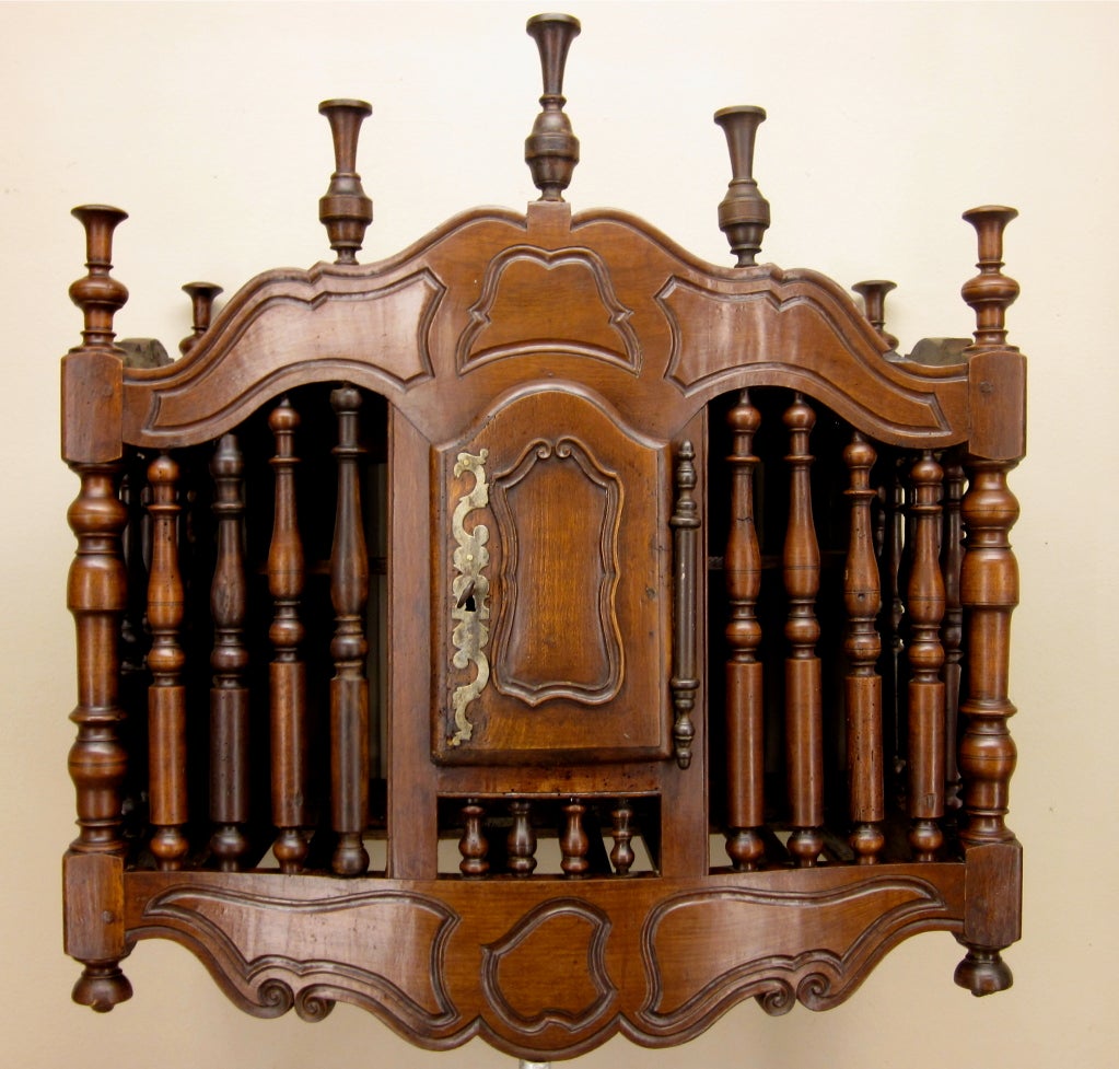 A panetiere from the south of France made of walnut with a serpentine front. To be hung above a petrin ( dough box) or a side table. Was used to keep the bread and highly decorative.
Please visit my web site for more beautiful antiques at
