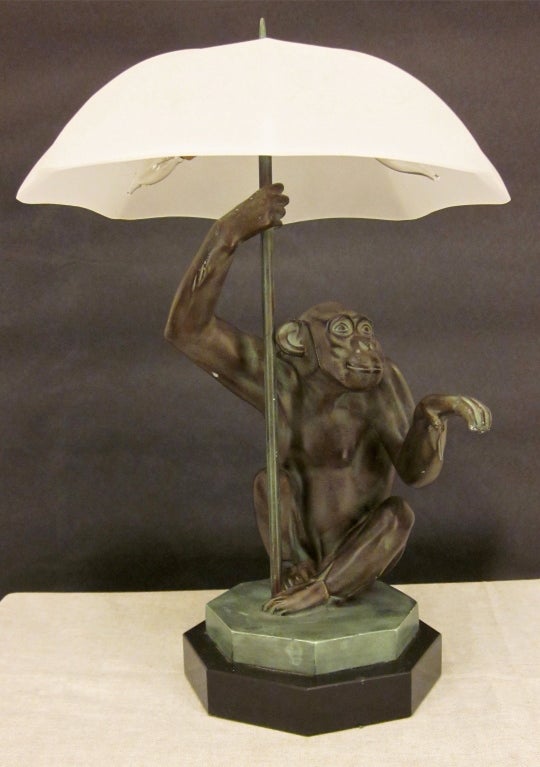 A good Monkey Bronze Lamp on a marble base. Signed Le Verrier - Paris. One chip on the marble base. Otherwise good condition, electrified. New frosted glass shade duplicates the original one.