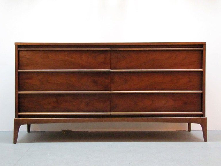 elegant walnut double dresser by Lane
the unit features six sculptural drawers, marked
