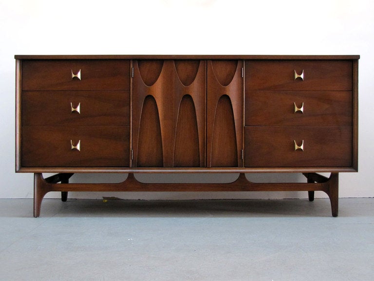 original Brasilia 6 drawer/2 door credenza by Broyhill Premier
this line was an homage to Oscar Niemeyer's architecture of Brasil and was first featured at the Seattle World’s Fair in 1962 representing the city of Brasilia. Great sculpted wood