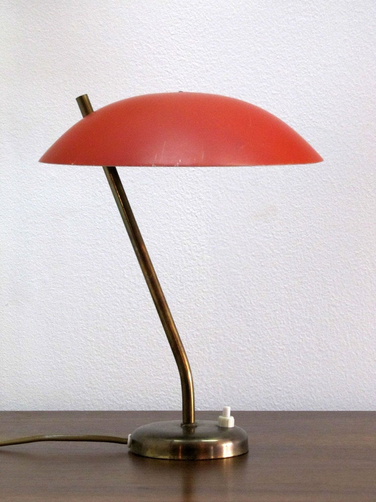 wonderful petite danish table lamp in brass with enameled red shade
on/off switch at the base