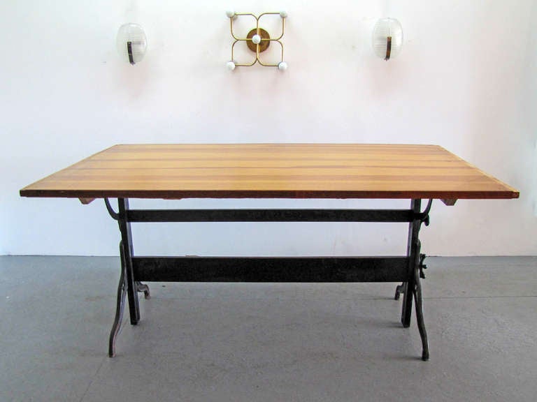 large iron and wood dining table by Hamilton, adjustable as large architectural desk, height 32.75