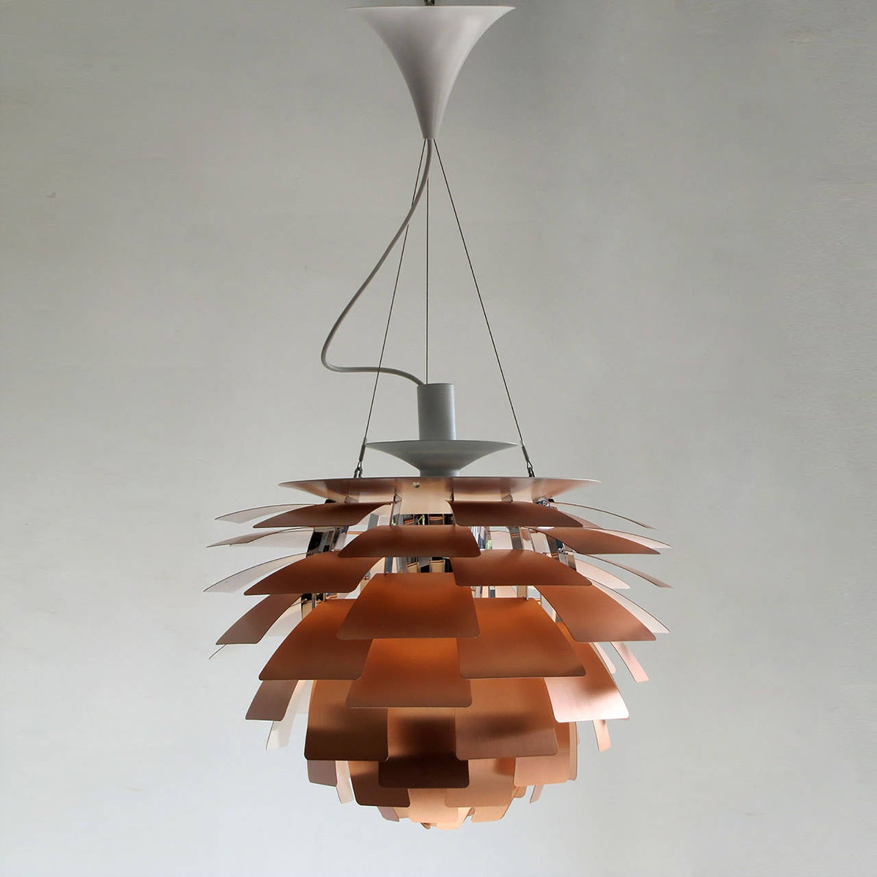 Vintage iconic brushed copper hanging pendant lamp by Poul Henningsen, manufactured by Louis Poulsen, Denmark. PH Artichoke (1958) is a 360-degree glare free Luminaire created by 72 copper leaves, which shield the light source, redirect and reflect