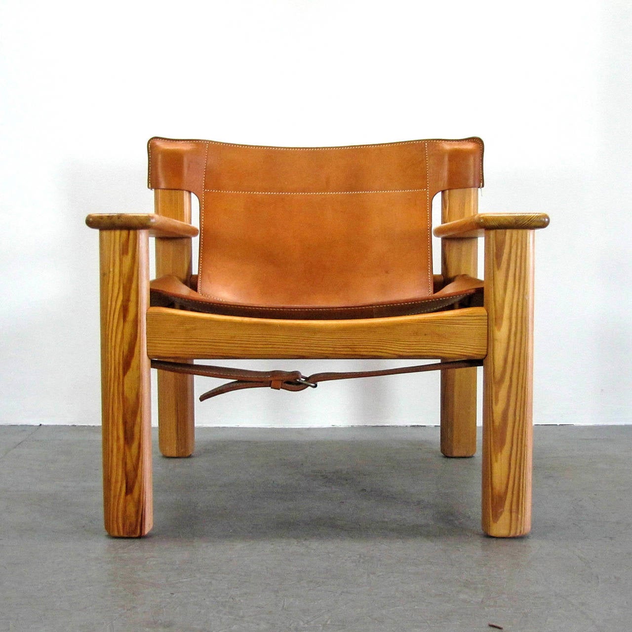 Bold and comfortable pair of Danish modern lounge chairs, by Bernt Petersen, Denmark, 1970, oversized pine frames with thick cognac colored leather with incredible patina.