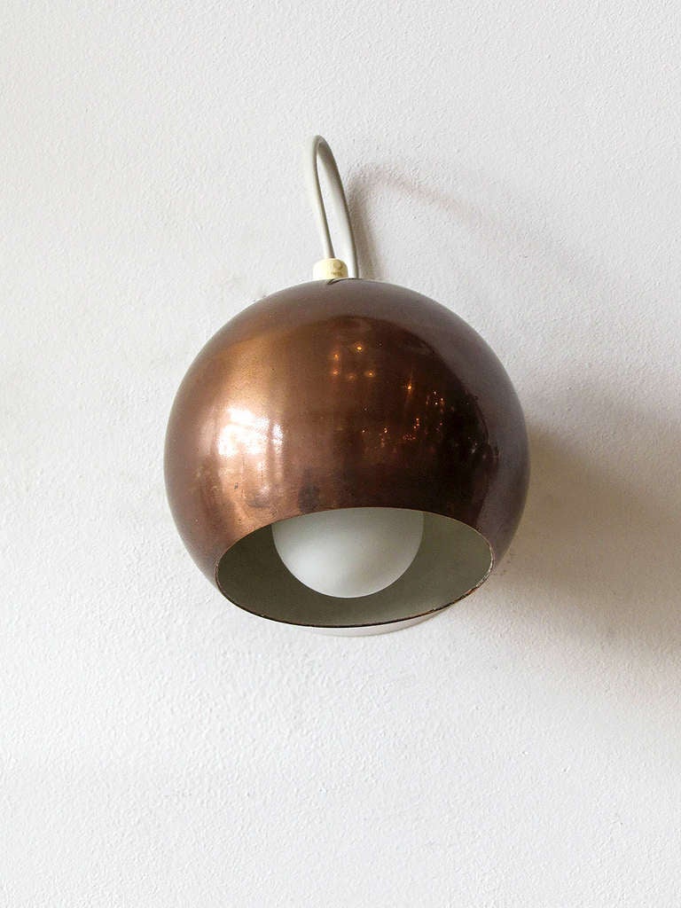 stunning pair of magnetic copper-colored ball sconces by Reggiani, due to the magnetic base, the shades are fully and easily adjustable, label present