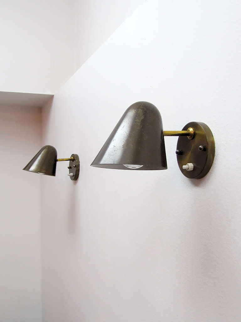 elegant pair of Jacques Biny wall sconces, original backplates with individual light switch, mounted on ball joint for full shade rotation, priced as a pair