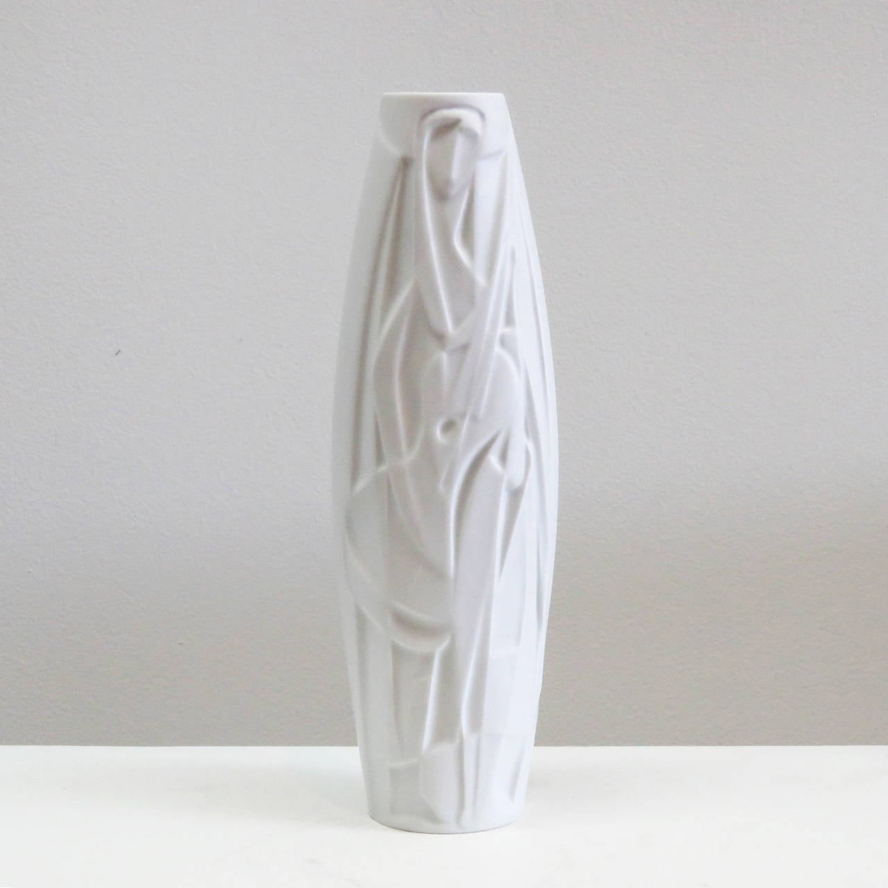 Stunning bisque porcelain Op Art vase with abstract relief of a female musician, designed by Cuno Fischer for Rosenthal Studioline, marked.