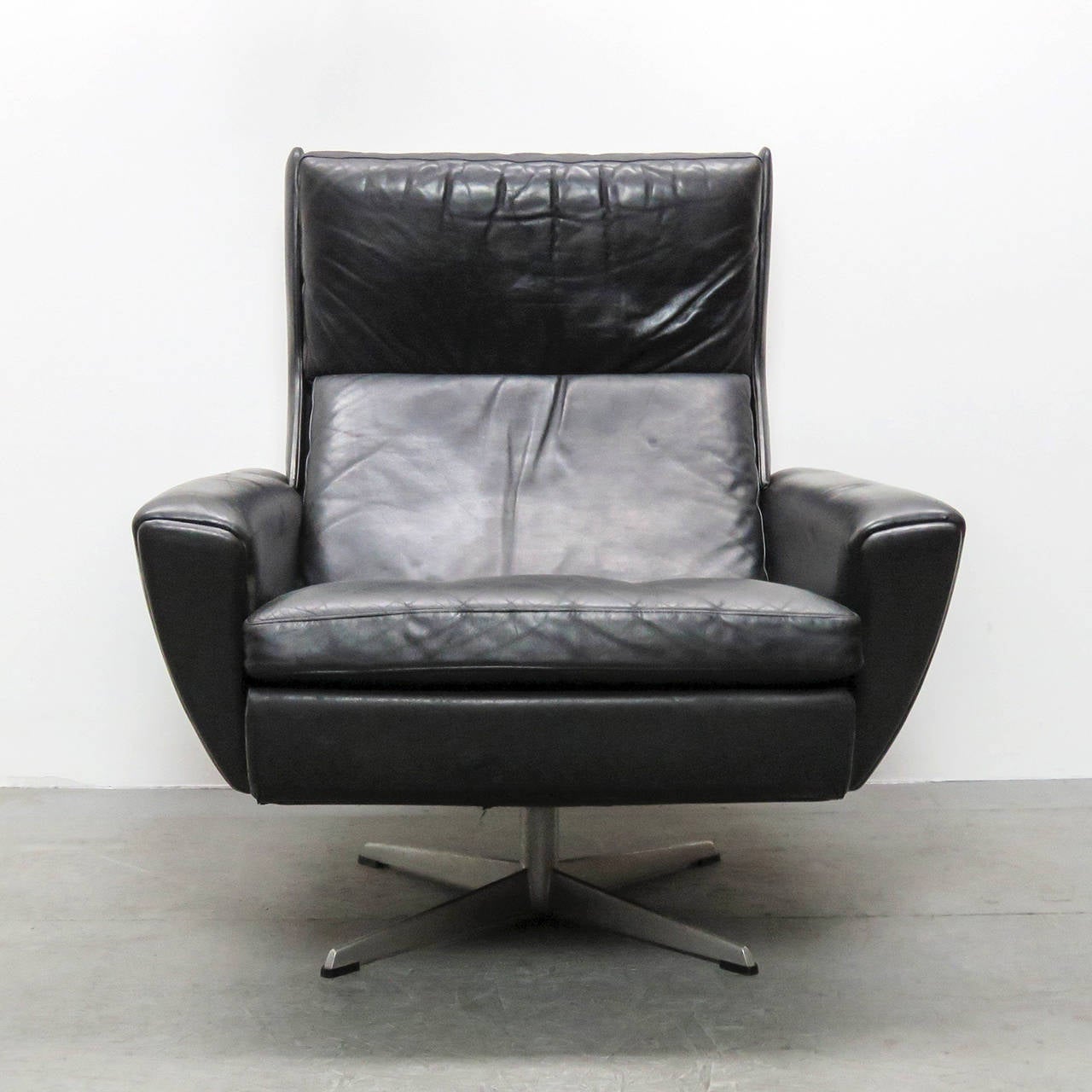 wonderful Georg Thams wing back lounge chair with ottoman in black leather and chrome plated aluminum