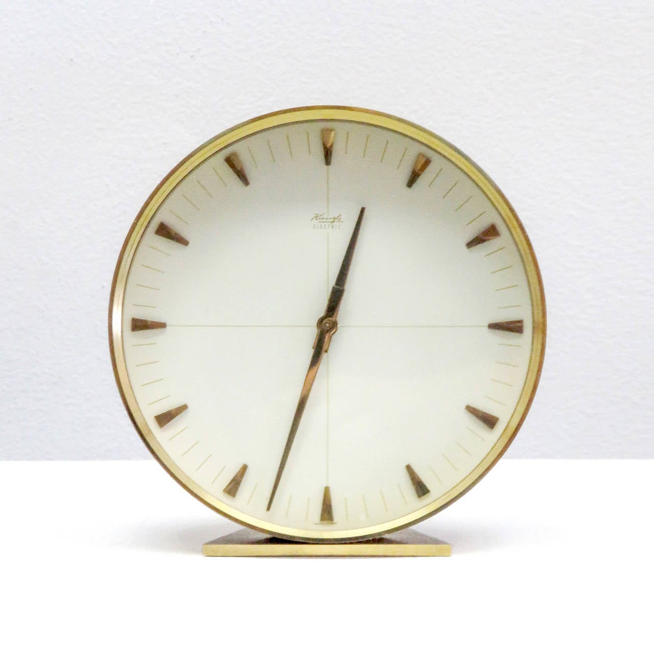 Minimalist, 1960s automatic table clock by Kienzle, Germany, brass housing, marked Kienzle Electric.