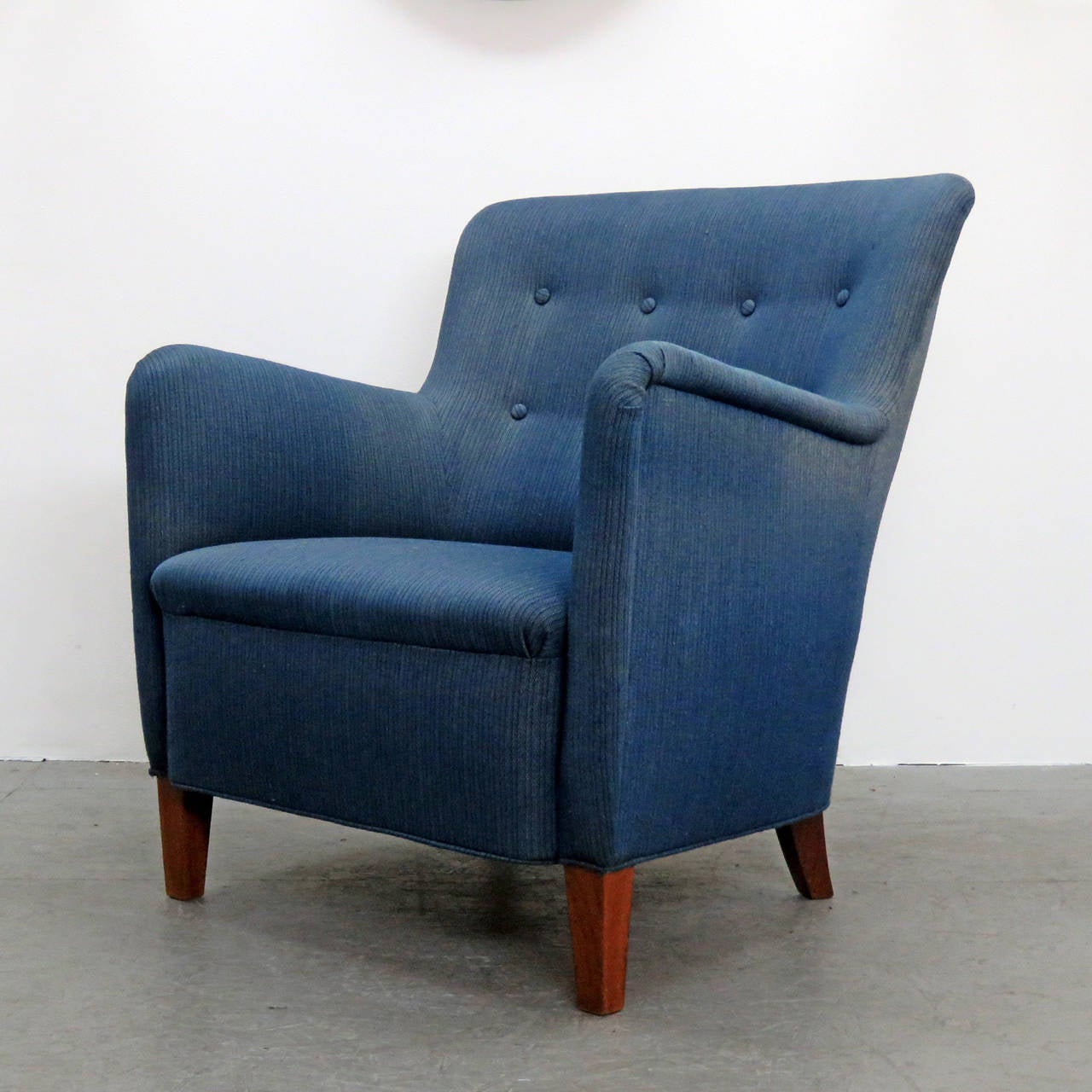 Wonderful dansk mobler club chair in style of Fritz Hansen easy chairs 1669 with original blue upholstery and teak legs.