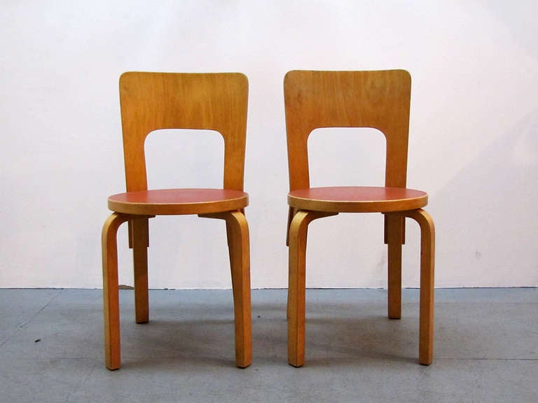 set of six early No. 66 chairs by Alvar Aalto for Artek in beechwood with red linoleum seats