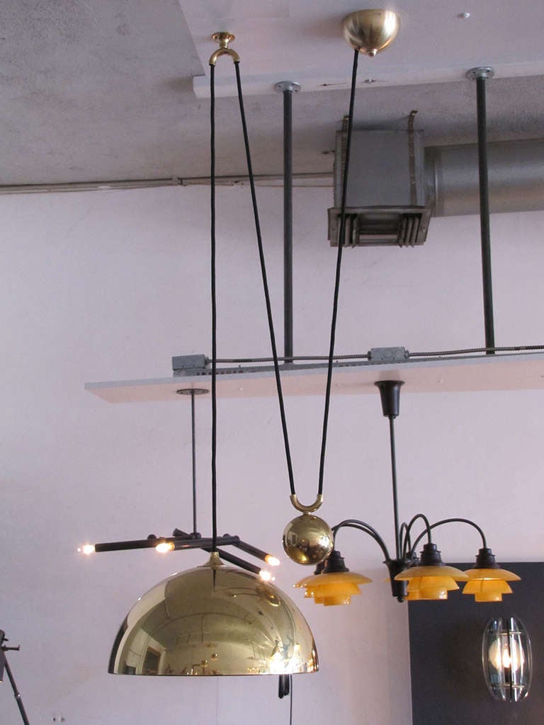 beautiful brass counterweight pendant with very heavy sphere pulley mechanism, current extension capability from 12