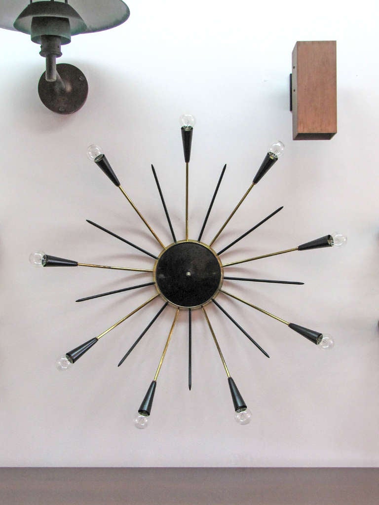 stunning twelve light sputnik flush mount light with 12 alternating black enameled decorative prongs, wall or ceiling mounted