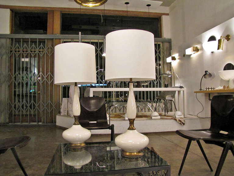 Tall, voluptuous ceramic bodies with articulate brass transitions & custom shade