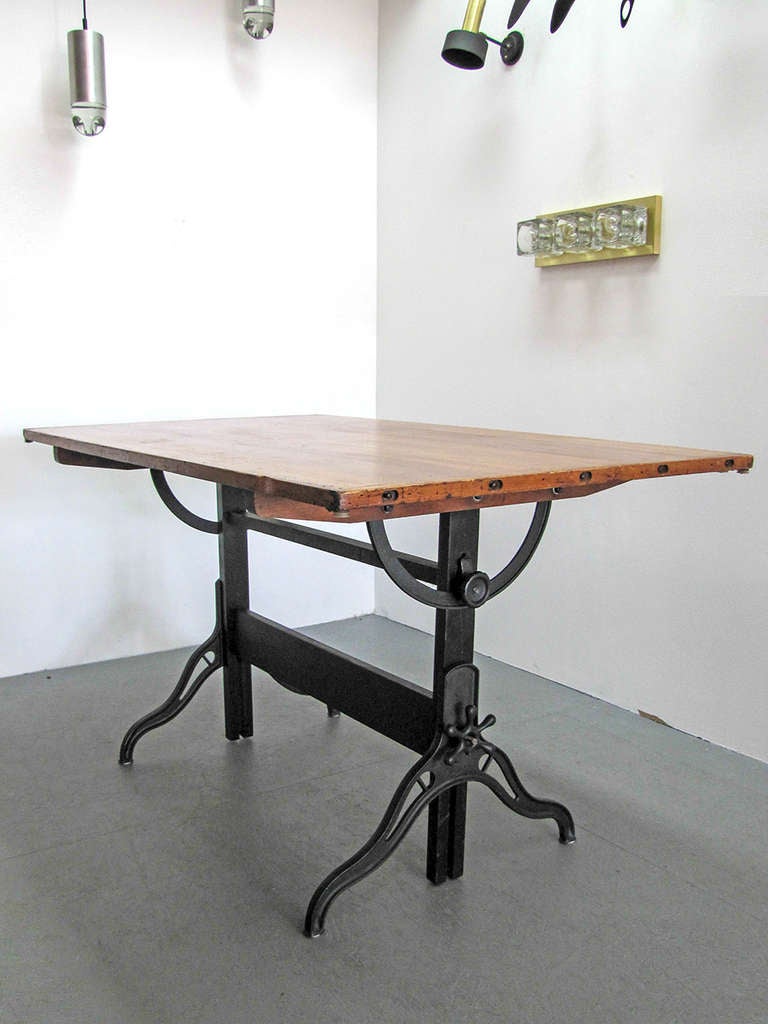large iron and wood dining table, adjustable as large architectural desk, height 32.5