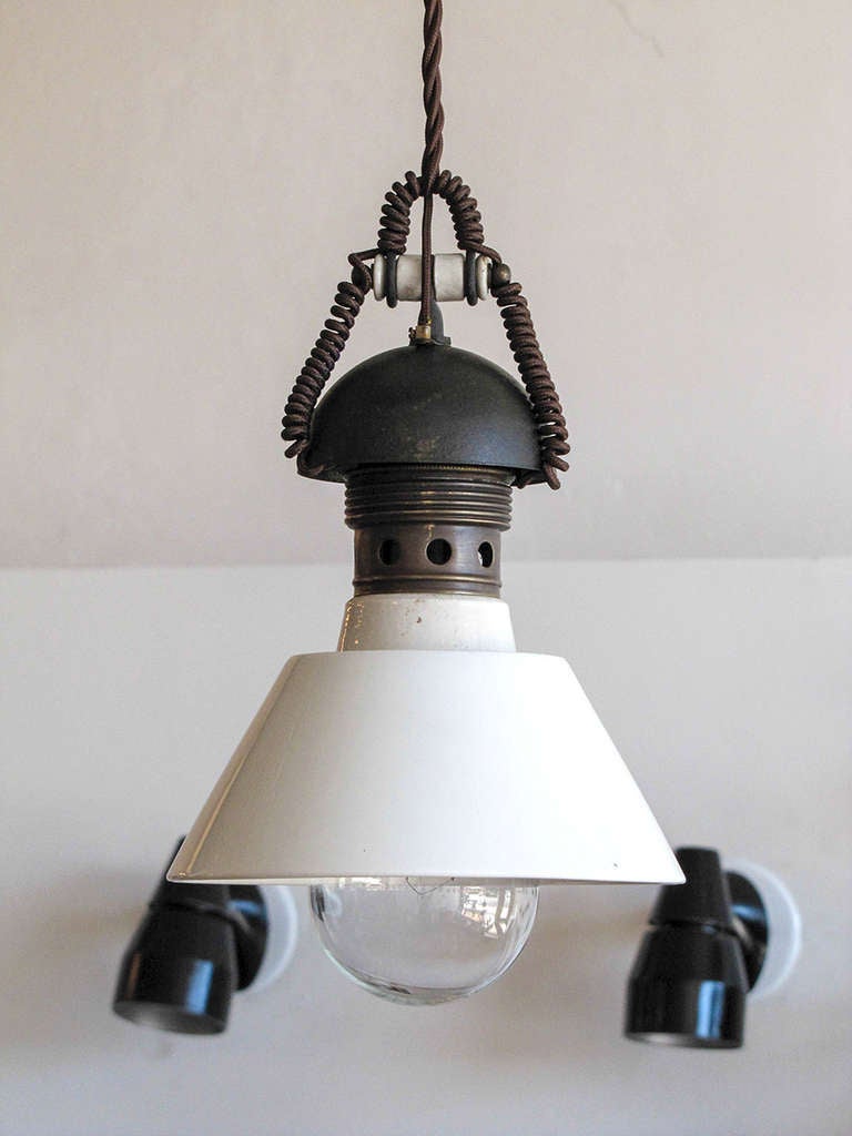 wonderful pair of Italian industrial pendants with metal housing and porcelain shades