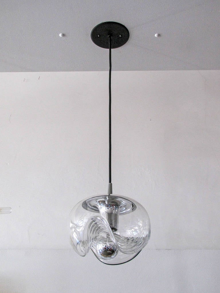 timeless clear glass pendants by Peill & Putzler, wave pattern on the underside of an 8.5" globe, chrome hardware, individually: $1200.00, matching wall lights available