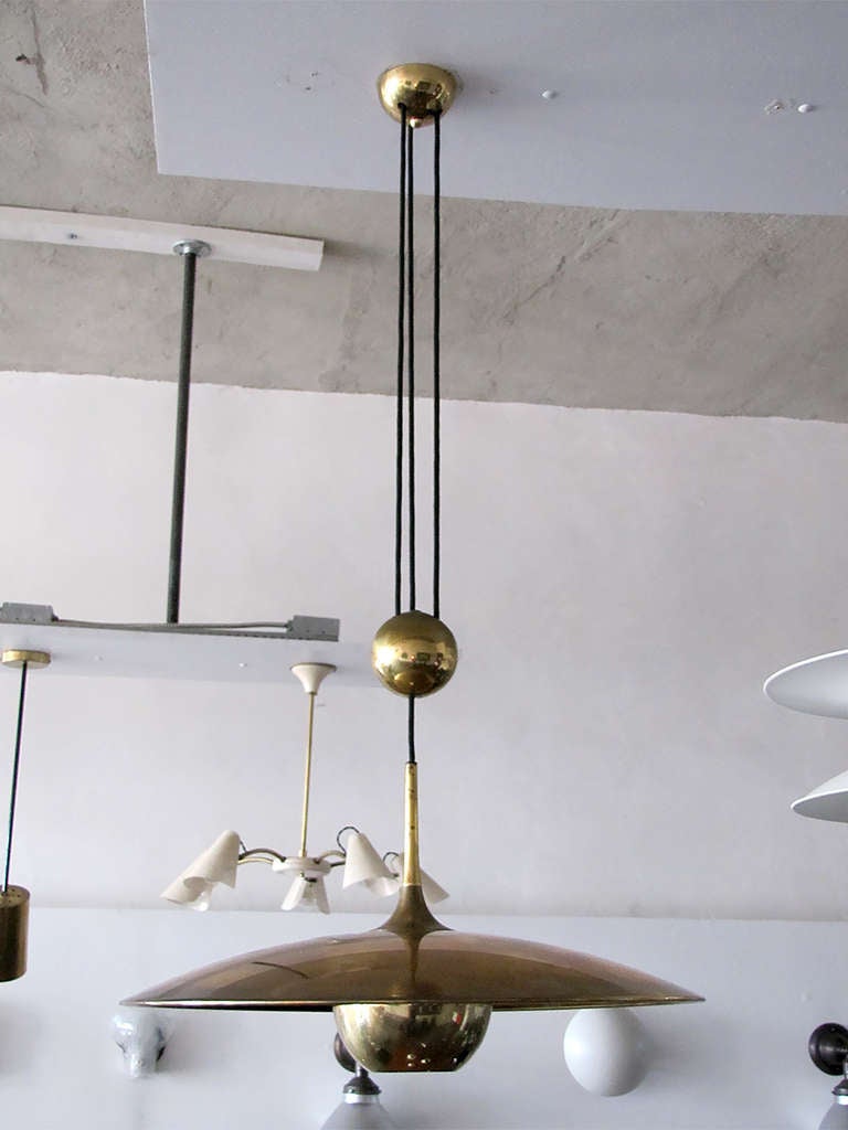 large brass saucer by Florian Schulz with pulley mechanism, a HEAVY brass ball counter balances the weight of the fully adjustable shade