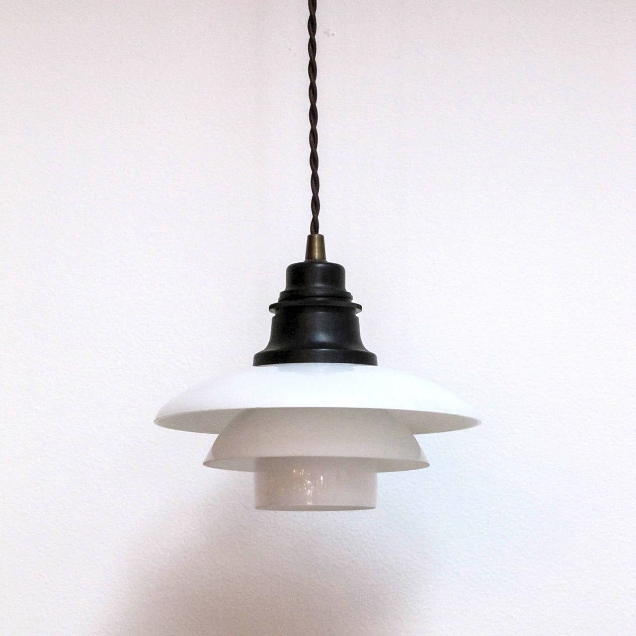 Outstanding PH-2 pendant lights by Poul Henningsen for Louis Poulsen.
Opal glass on bakelite sockets, signed or stamped at each socket, patented PH-2.
