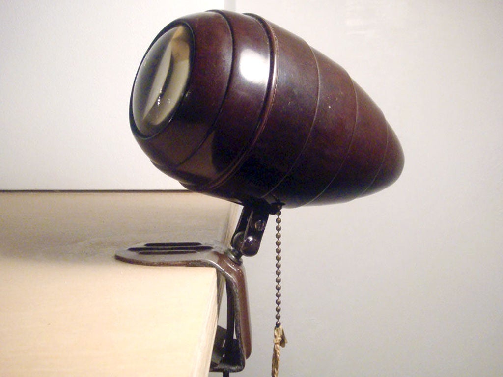 bakelite clamp lights, adjustable light direction

table/desk, headboard

priced per lamp