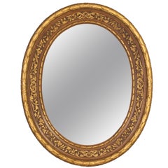A Gilt Solid Mahogany Napoleon III Oval Mirror